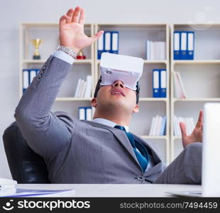 Businessman with virtual reality glasses in modern technology concept. Businessman with virtual reality glasses in modern technology co