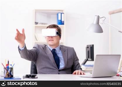 Businessman with virtual reality glasses in office