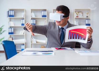 Businessman with virtual reality glasses in the office