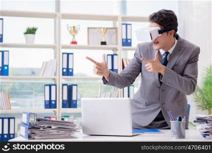 Businessman with VR virtual reality glasses in office