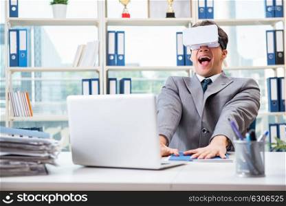 Businessman with VR virtual reality glasses in office. The businessman with vr virtual reality glasses in office