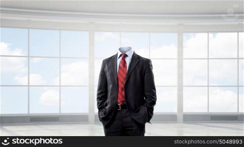 Businessman without head. Headless elegant businessman in modern office interior