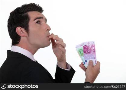 Businessman wondering what to do with his money