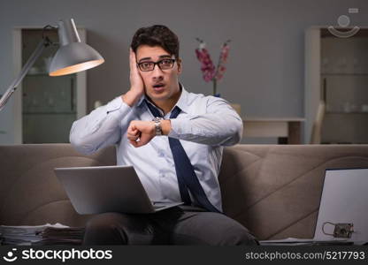 Businessman workaholic working late at home