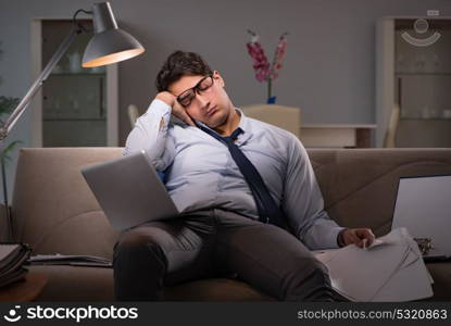 Businessman workaholic working late at home