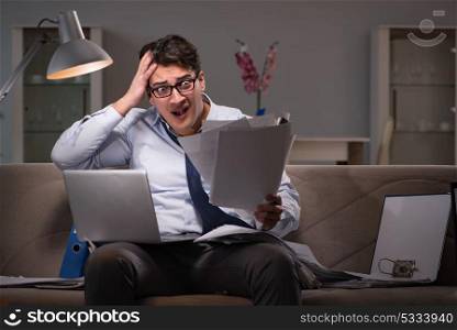 Businessman workaholic working late at home