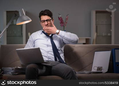 Businessman workaholic working late at home