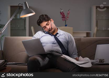 Businessman workaholic working late at home