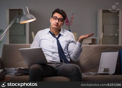 Businessman workaholic working late at home