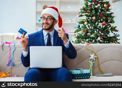 Businessman working at home during christmas