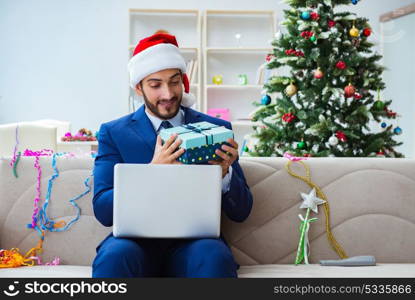 Businessman working at home during christmas