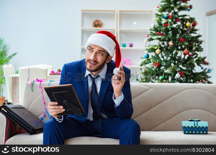 Businessman working at home during christmas