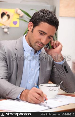 Businessman working at the breakfast table