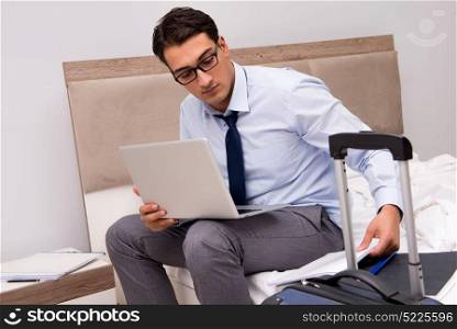 Businessman working during business trip in hotel