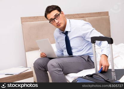 Businessman working during business trip in hotel