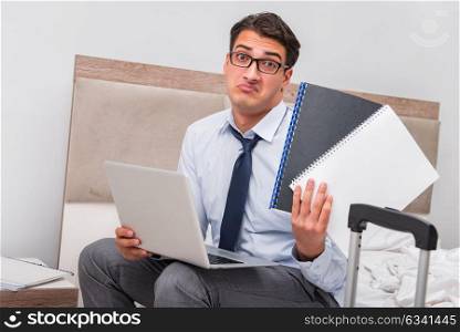 Businessman working during business trip in hotel