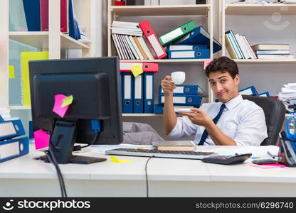 Businessman working in the office with piles of books and papers. Businessman working in the office with piles of books and papers doing paperwork