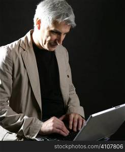 businessman working laptop computer, senior gray hair