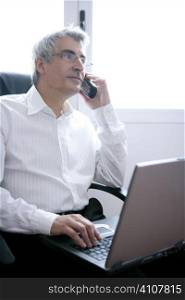 businessman working laptop computer, senior gray hair talking phone
