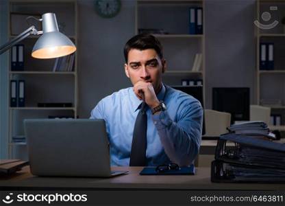 Businessman working late at night in overtime shift