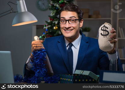 Businessman working late on christmas day in office