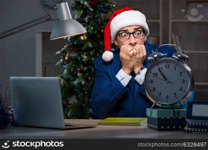 Businessman working late on christmas day in office. The businessman working late on christmas day in office