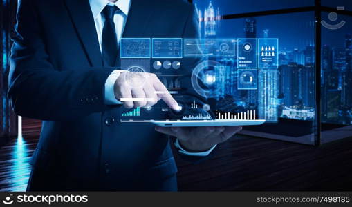 Businessman working on digital table with intelligence and analytics of business showing on virtual screen .