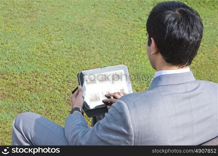 Businessman working on his tablet