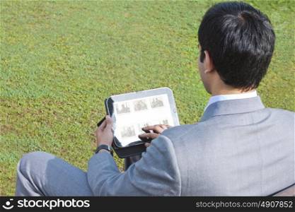 Businessman working on his tablet