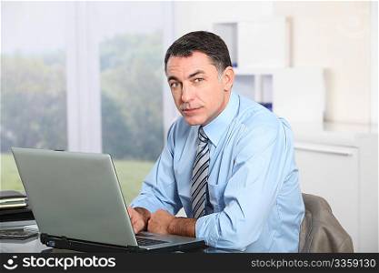 Businessman working on laptop computer