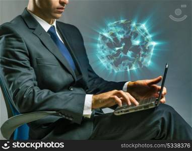 Businessman working on laptop in business concept