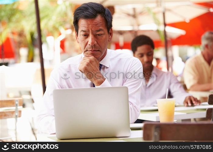 Businessman Working On Laptop In Outdoor Caf?