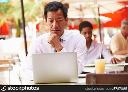 Businessman Working On Laptop In Outdoor Caf?
