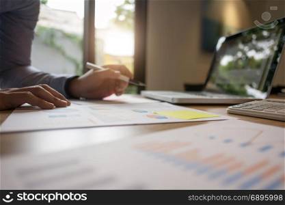 businessman working on report documents at home