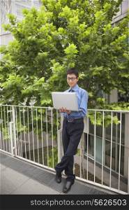Businessman working outdoors with his laptop