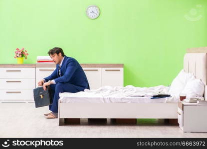 Businessman working overtime in hotel room