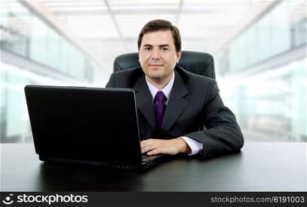 businessman working with a laptop, at the office
