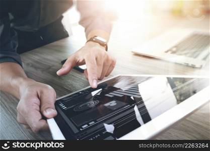 businessman working with blank screen digital tablet computer and smart phone and laptop computer on wooden desk as concept