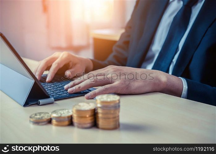 Businessman working with coin money currency. Concept of investment growth and money saving.. Businessman working with coin money currency.
