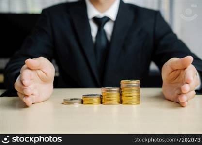 Businessman working with coin money currency. Concept of investment growth and money saving.