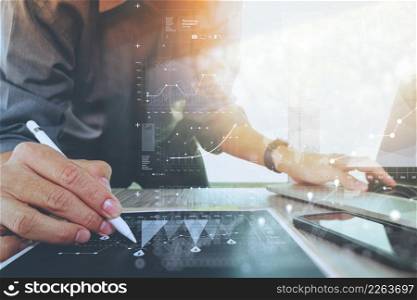 businessman working with digital laptop computer and smart phone with digital business strategy layer effect on wooden desk as concept