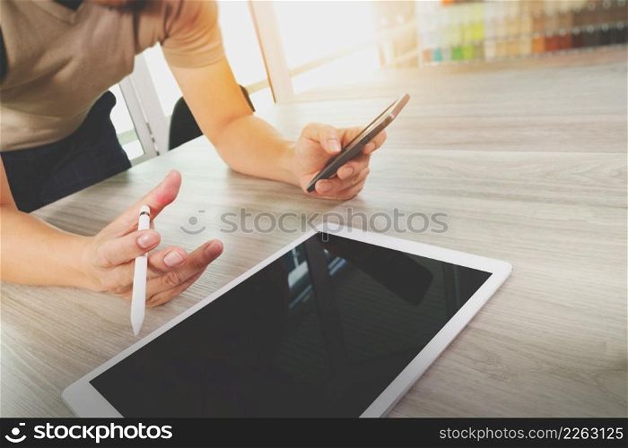 businessman working with digital tablet computer and smart phone on wooden desk as concept