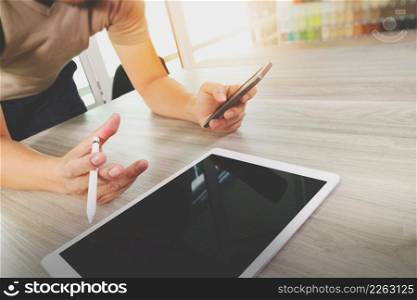 businessman working with digital tablet computer and smart phone on wooden desk as concept