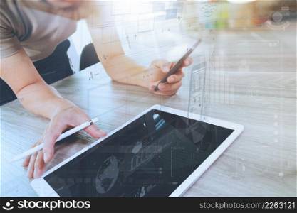 businessman working with digital tablet computer and smart phonewith digital business strategy layer effect on wooden desk as concept