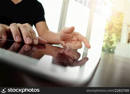 businessman working with digital tablet computer on wooden desk as concept