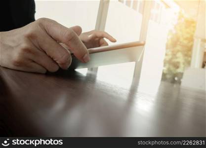 businessman working with digital tablet computer on wooden desk as concept