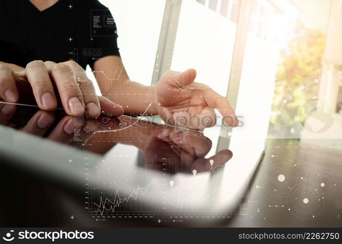 businessman working with digital tablet computer with digital business strategy layer effect on wooden desk as concept