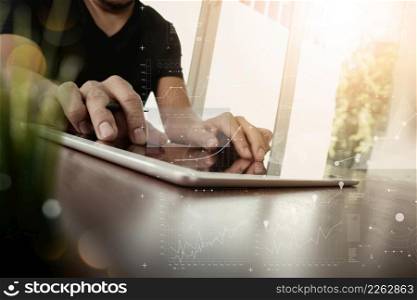 businessman working with digital tablet computer with digital business strategy layer effect on wooden desk with green plant foreground as concept