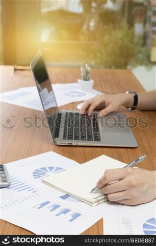 businessman working with document and computer notebook laptop on office desk