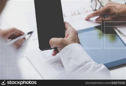 businessman working with document, smartphone and digital tablet for use as office workplace concept